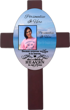 Load image into Gallery viewer, Personalized oval cross with a photo and your own words. Cross has a memorial saying because someone we love is in heaven, there is a little bit of heaven in our home. Cross has a beach background.