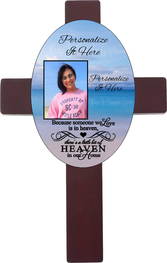 Personalized oval cross with a photo and your own words. Cross has a memorial saying because someone we love is in heaven, there is a little bit of heaven in our home. Cross has a beach background.