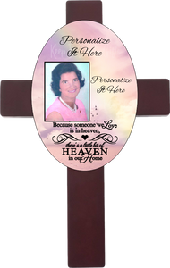 Personalized oval cross with a photo and your own words. Cross has a memorial saying because someone we love is in heaven, there is a little bit of heaven in our home. Cross has a rainbow background.