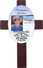 Load image into Gallery viewer, Personalized oval cross with a photo and your own words. Cross has a memorial saying because someone we love is in heaven, there is a little bit of heaven in our home. Cross has a waterfall background.